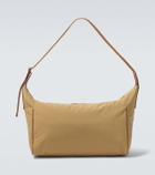 The Row Logan E/W leather-trimmed crossbody bag