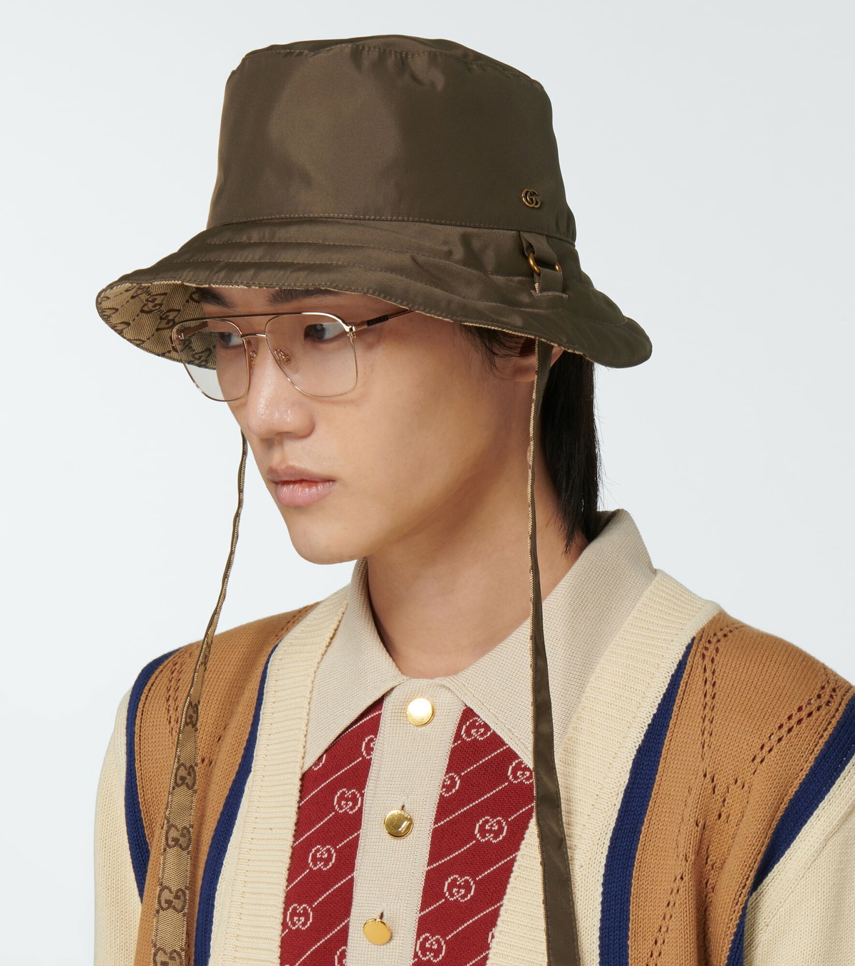 Shop the Reversible hat in GG canvas and nylon in brown at GUCCI