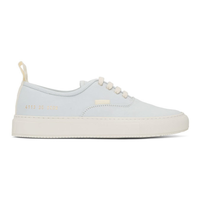Photo: Woman by Common Projects White Nubuck Four Hole Low Sneakers