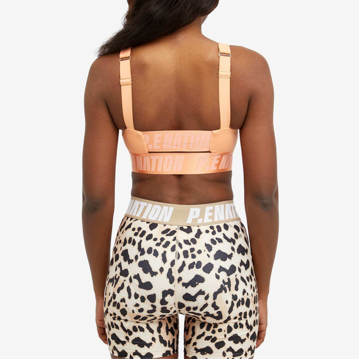 P.E Nation Women's Backcheck Sports Bra in Cantaloupe