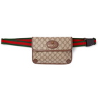 Gucci - Ophedia Leather-Trimmed Monogrammed Coated-Canvas Belt Bag - Brown