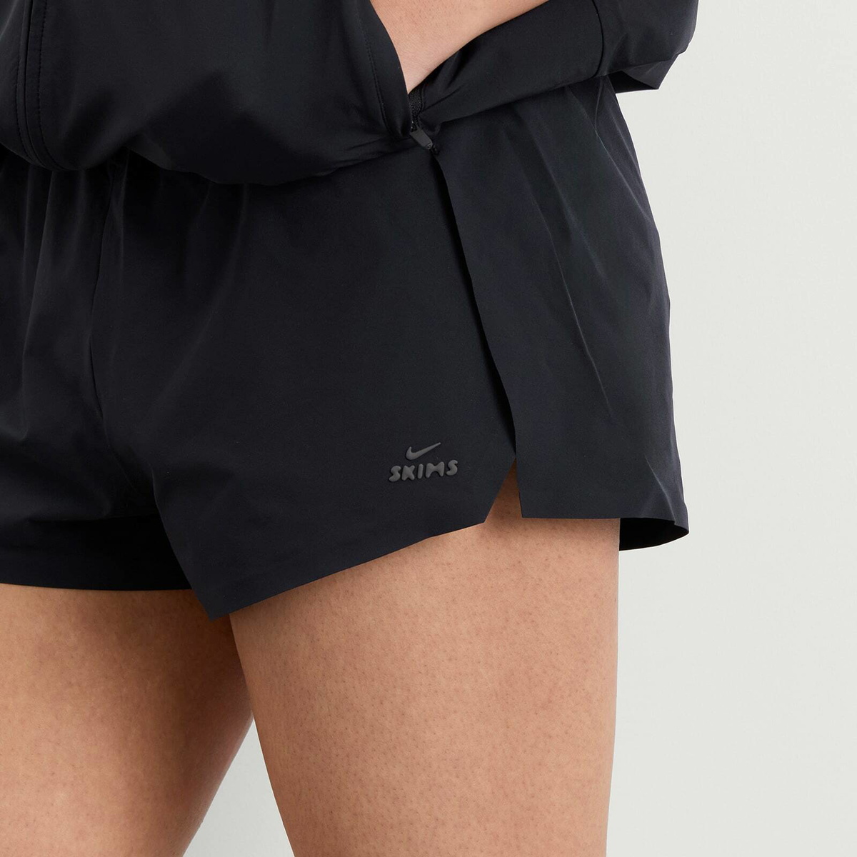 Nike Women's x SKIMS Stretch Nylon Runner Short in Obsidian