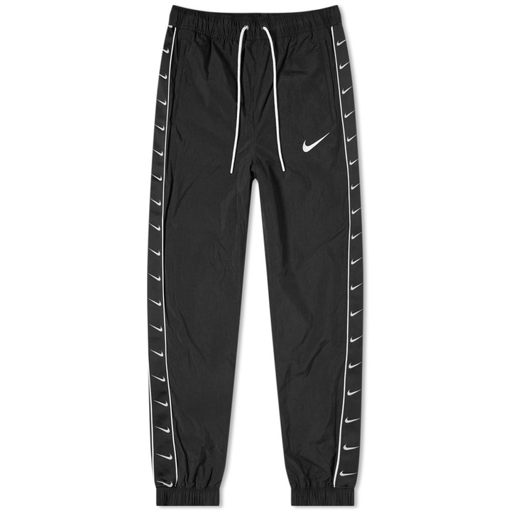 Photo: Nike Taped Swoosh Woven Pant