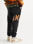 AMIRI - Slim-Fit Tapered Logo-Appliquéd Cotton-Jersey Sweatpants - Black