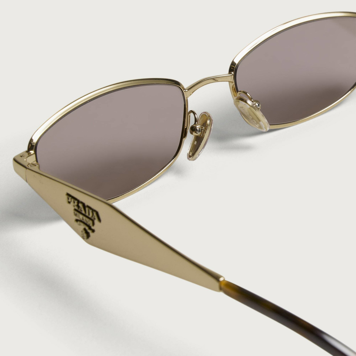 Prada Eyewear D51S Sunglasses in Gold/Light Purple Brown