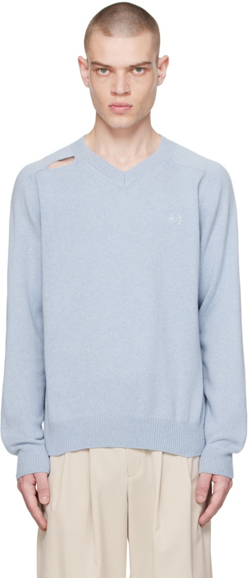 Photo: Commission Blue Cutout Sweater