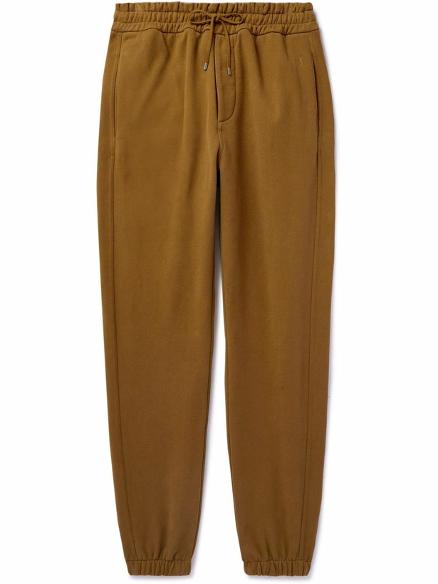 Photo: SAINT LAURENT - Tapered Logo-Embroidered Cotton-Jersey Sweatpants - Brown
