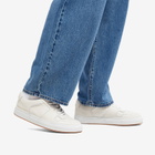 Woman by Common Projects Women's Decades Low Trainers Sneakers in White