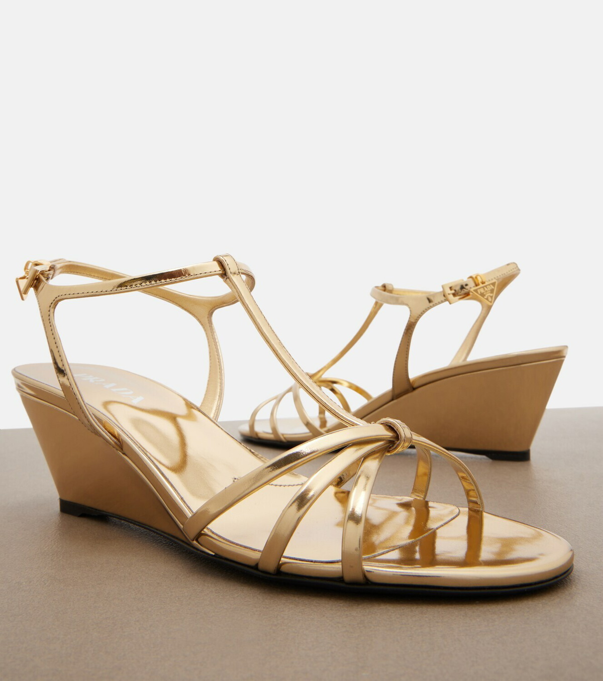 Prada Metallic leather wedge sandals