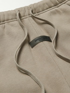 FEAR OF GOD ESSENTIALS - Slim-Fit Tapered Logo-Flocked Cotton-Blend Jersey Sweatpants - Brown