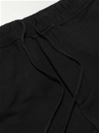 SAINT LAURENT - Tapered Logo-Embroidered Cotton-Jersey Sweatpants - Black