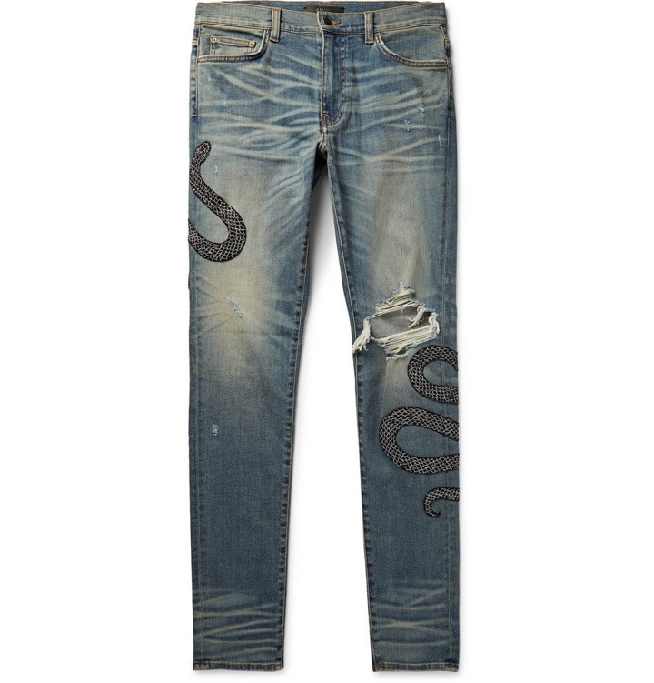 Photo: AMIRI - Skinny-Fit Appliquéd Distressed Stretch-Denim Jeans - Men - Light denim