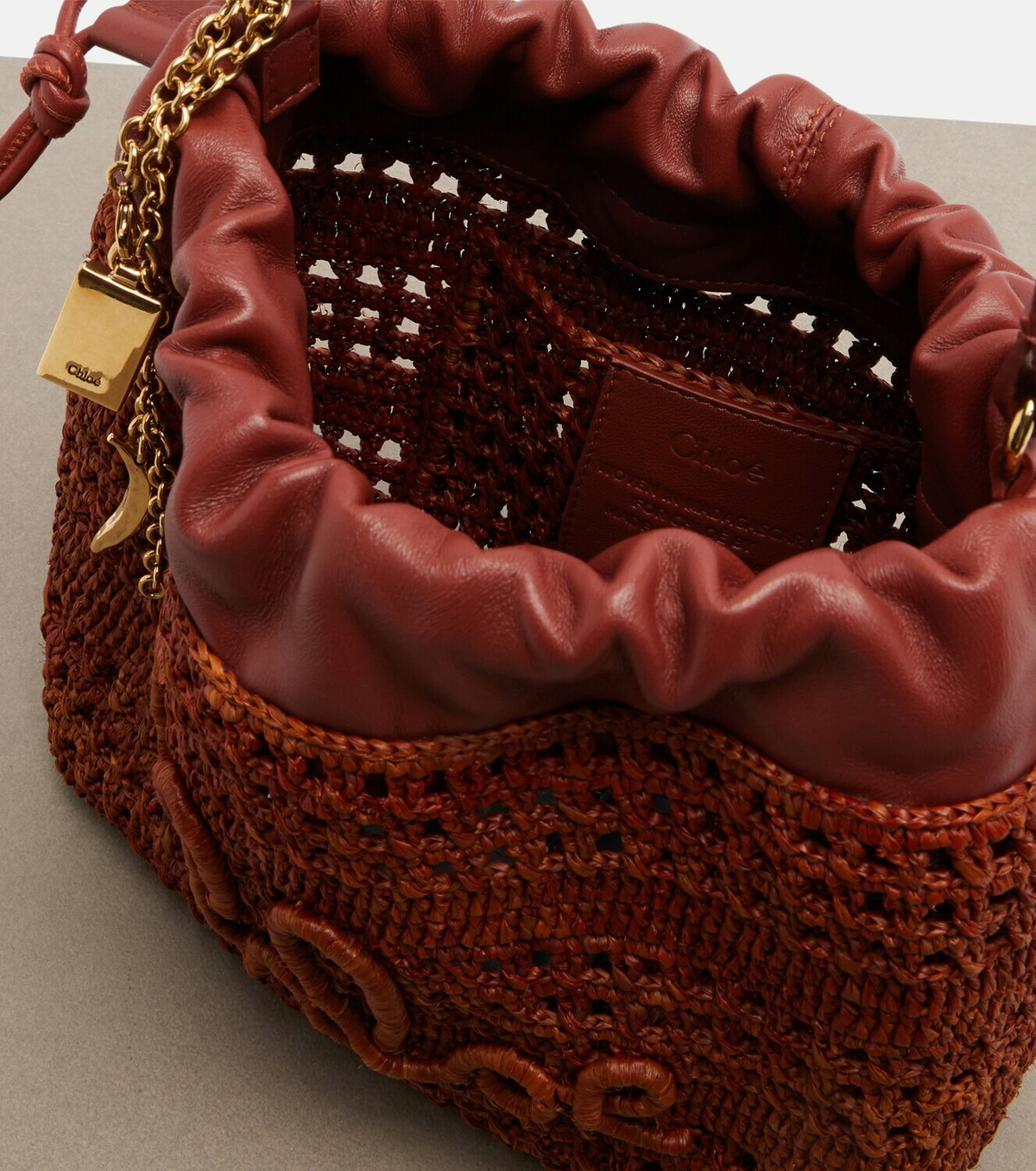 Chloé Mini leather-trimmed raffia bucket bag
