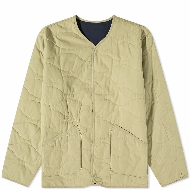 Photo: Universal Works Men's Reversible Quilted Liner Jacket in Olive/Navy