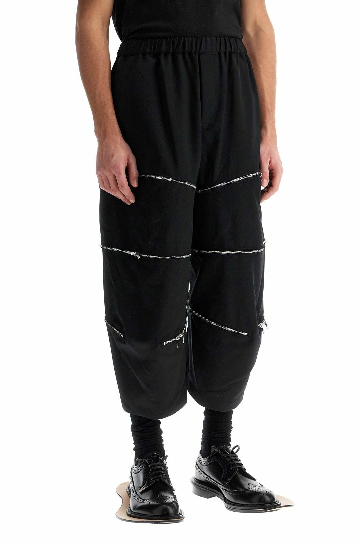 COMME DES GARCONS BLACK cropped pants with zip openings. Black