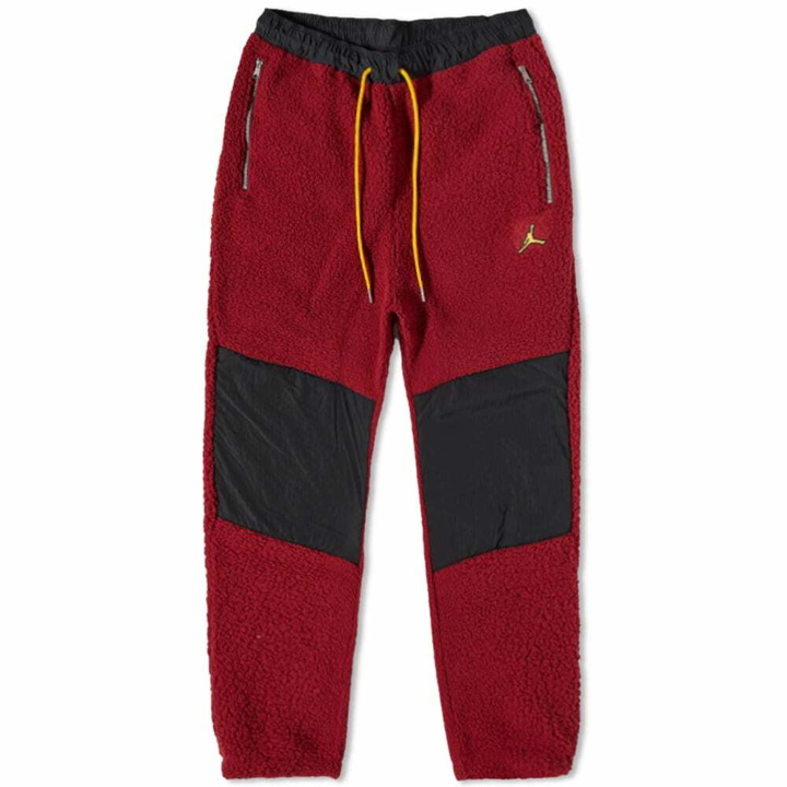 Photo: Air Jordan Men's Essential Fleece Winter Pant in Cherrywood Red