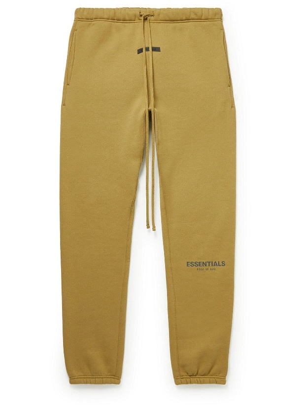 Photo: Fear of God Essentials - Tapered Logo-Print Cotton-Blend Jersey Sweatpants - Yellow