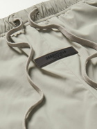 FEAR OF GOD ESSENTIALS - Tapered Logo-Appliquéd Nylon-Blend Track Pants - Gray