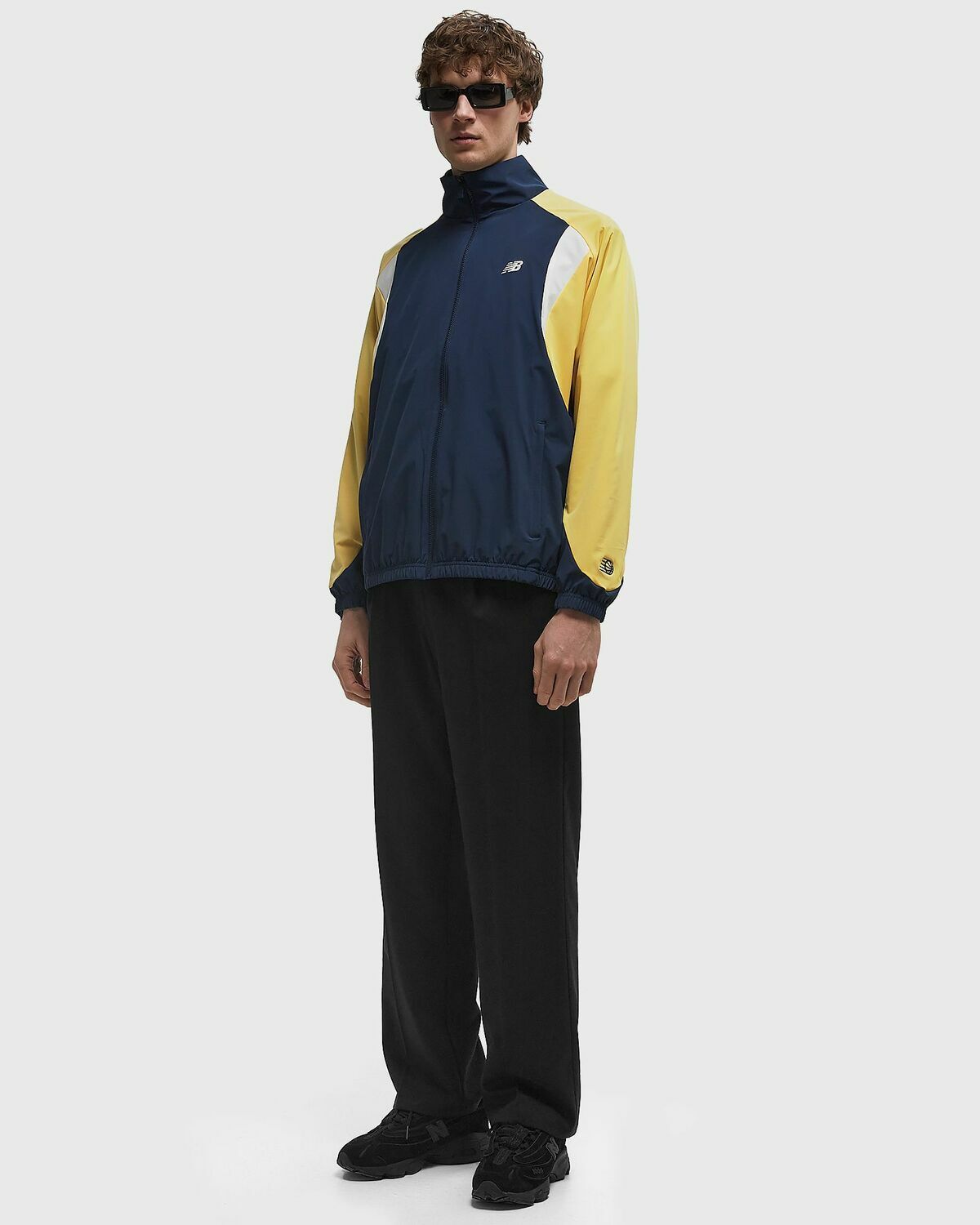 New Balance In Game Woven Track Jacket blue/yellow Men