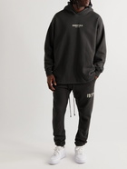 FEAR OF GOD ESSENTIALS - Slim-Fit Tapered Logo-Flocked Cotton-Blend Jersey Sweatpants - Gray