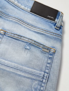 AMIRI - Skinny-Fit Panelled Distressed Jeans - Blue