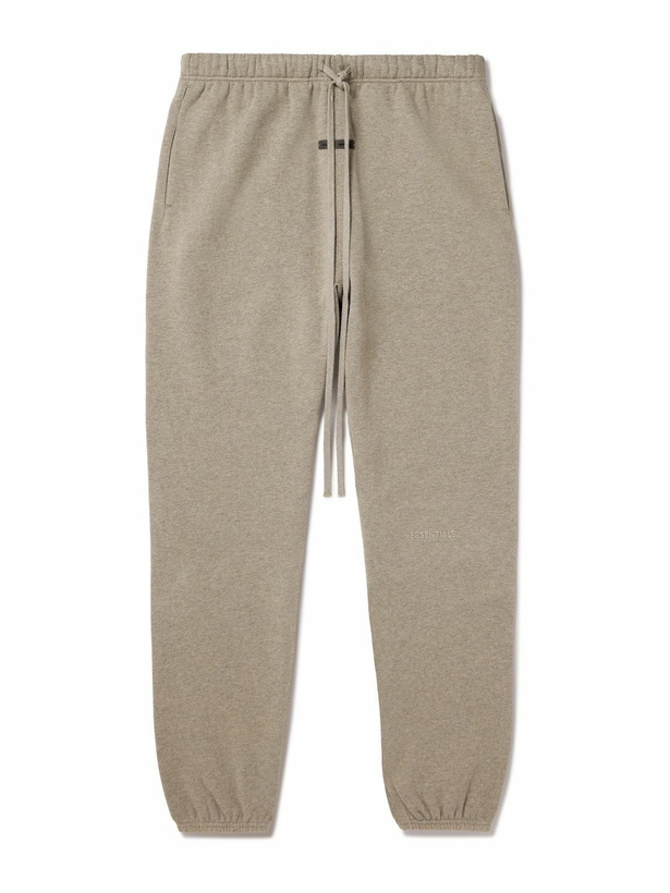 Photo: FEAR OF GOD ESSENTIALS - Tapered Logo-Appliquéd Cotton-Blend Jersey Sweatpants - Neutrals