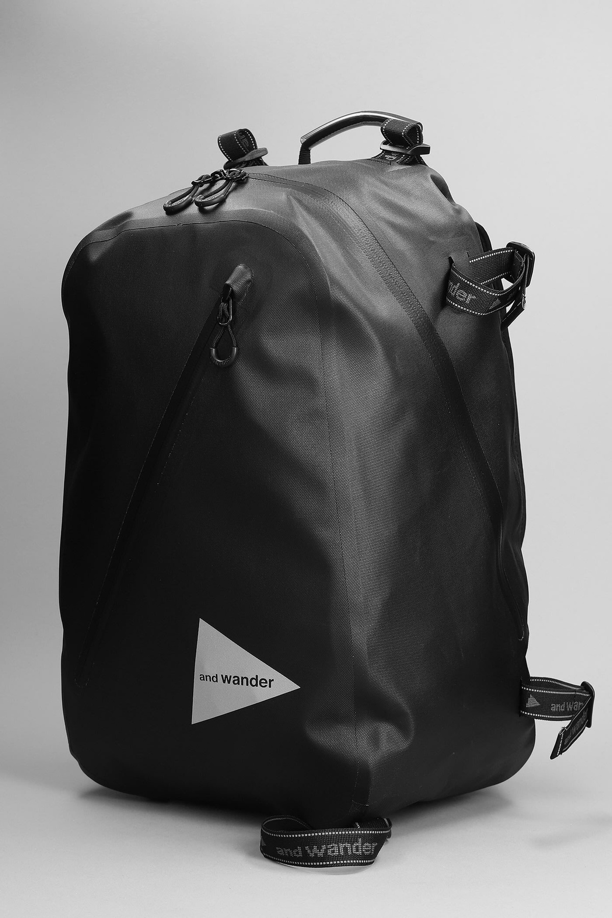And Wander Backpack In Black Nylon and Wander