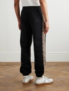 Burberry - Tapered Logo-Embroidered Checked Cotton-Jersey Sweatpants - Black