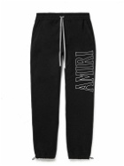 AMIRI - Zoltar Tapered Logo-Print Cotton-Jersey Sweatpants - Black