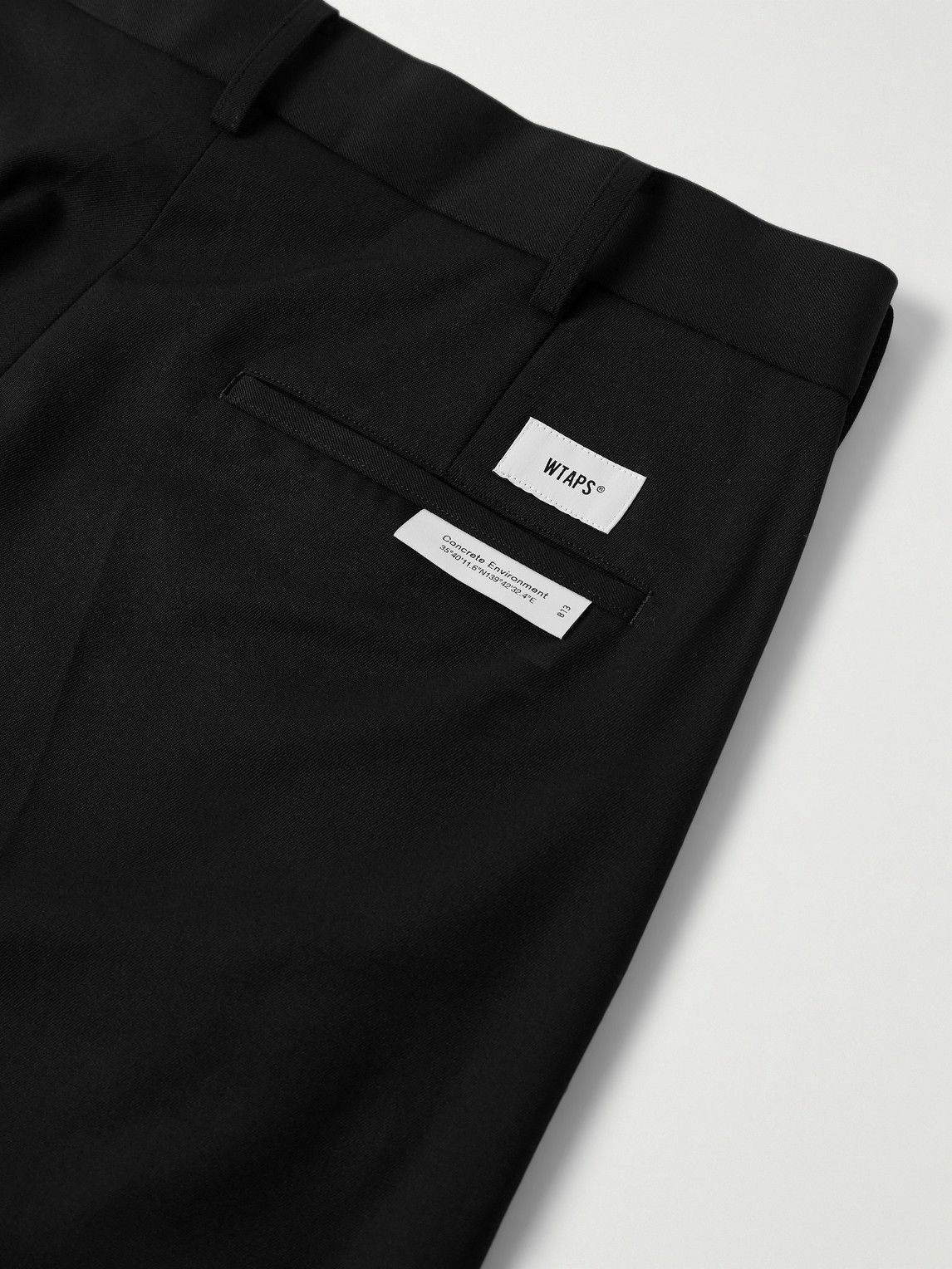 WTAPS - Cropped Tapered Logo-Appliquéd Pleated Twill Trousers - Black