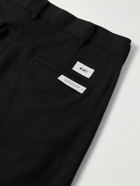 WTAPS - Cropped Tapered Logo-Appliquéd Pleated Twill Trousers - Black
