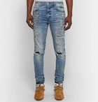 AMIRI - Skinny-Fit Distressed Paint-Splattered Stretch-Denim Jeans - Light blue