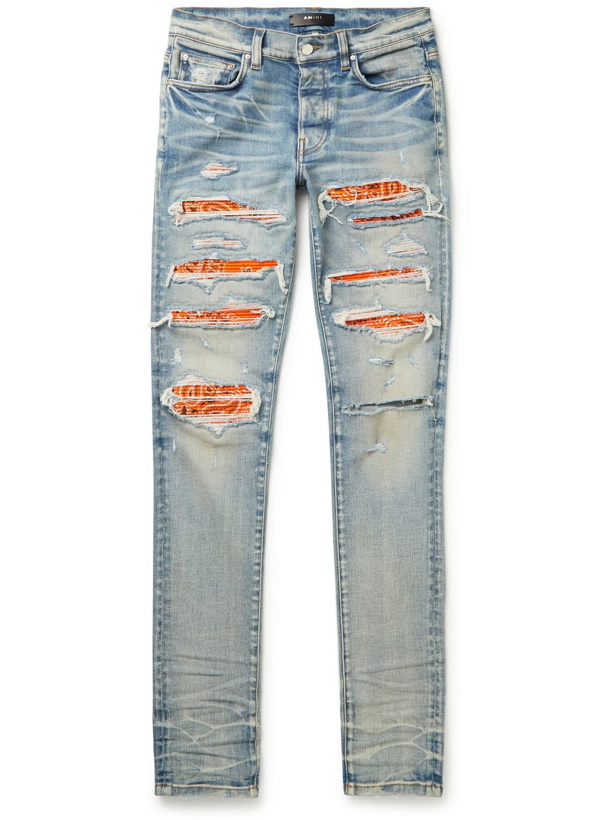 Photo: AMIRI - Thrasher Skinny-Fit Panelled Distressed Jeans - Blue