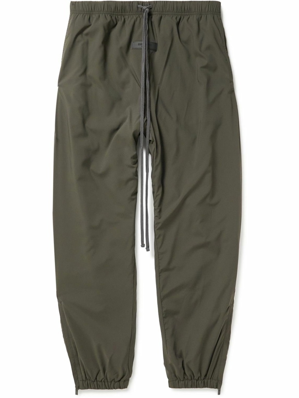 Photo: FEAR OF GOD ESSENTIALS - Tapered Logo-Appliquéd Padded Shell Drawstring Trousers - Black