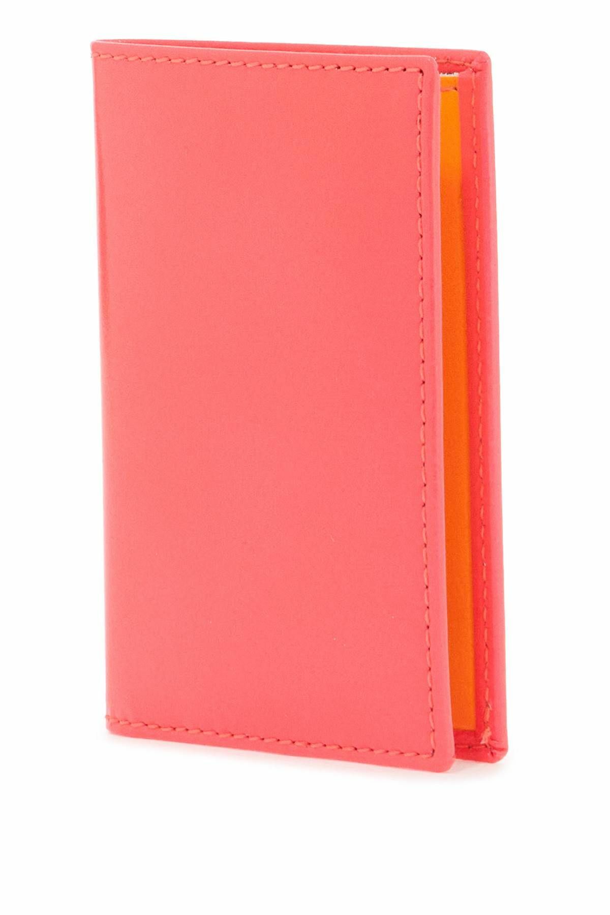 COMME DES GARCONS WALLET portafoglio compatto unisex rosa fluo in pelle di capra Pink