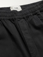 Folk - Assembly Cropped Tapered Pleated Garment-Dyed Cotton-Twill Trousers - Black