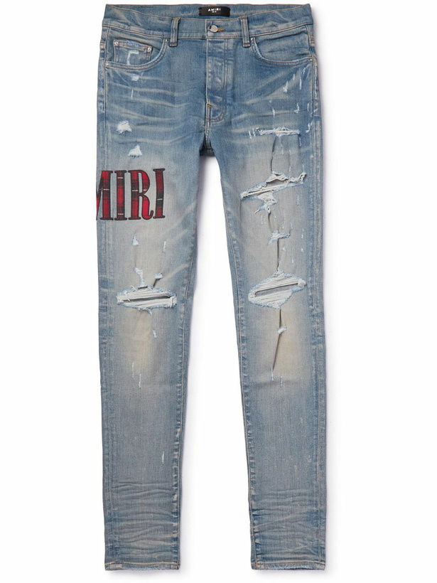 Photo: AMIRI - Skinny-Fit Appliquéd Distressed Jeans - Blue