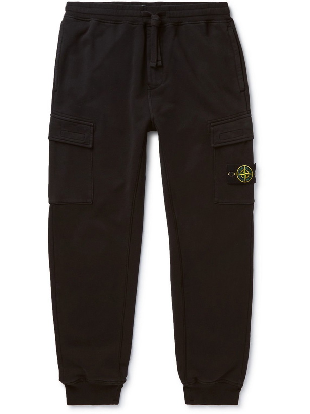 Photo: Stone Island - Tapered Logo-Appliquéd Garment-Dyed Fleece-Back Cotton-Jersey Sweatpants - Black
