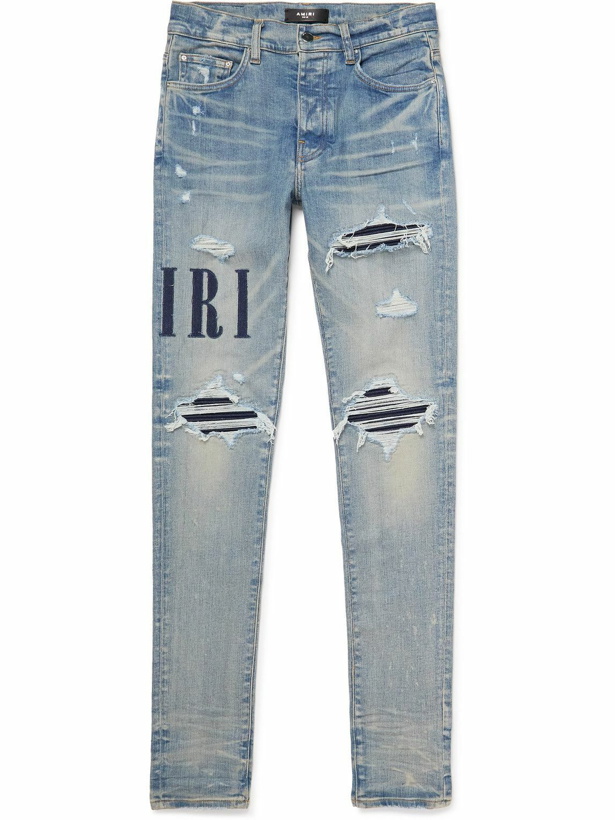 Photo: AMIRI - Skinny-Fit Appliquéd Distressed Jeans - Blue