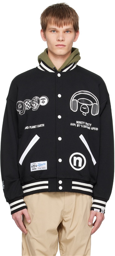 Photo: AAPE by A Bathing Ape Black Graphic Bomber Jacket