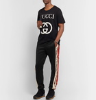 Gucci - Slim-Fit Tapered Printed Silk-Trimmed Jersey Track Pants - Black