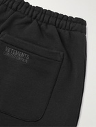 VETEMENTS - Tapered Logo-Print Cotton-Blend Jersey Sweatpants - Black