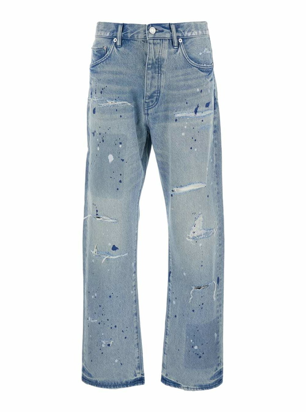 Photo: Purple Brand Blue Jeans With Logo Patch On The Rear And All-over Ripped Details In Denim Man