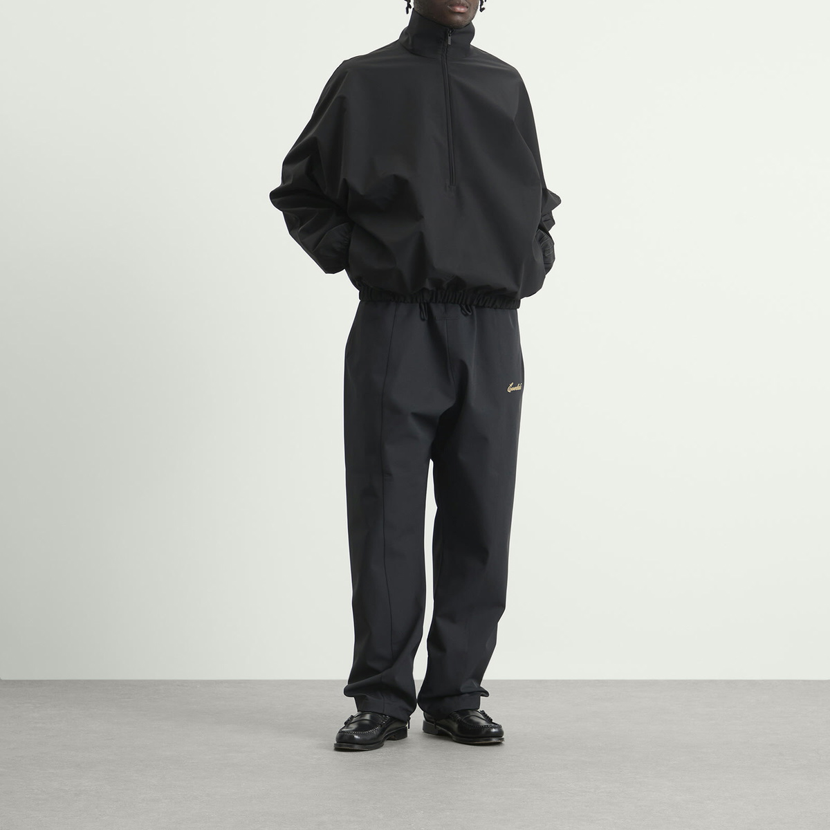 Fear of God ESSENTIALS Men's Active Trace 1/2 Zip Track Jacket in Vintage Black