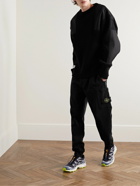 Stone Island - Tapered Logo-Appliquéd Garment-Dyed Cotton-Jersey Sweatpants - Black