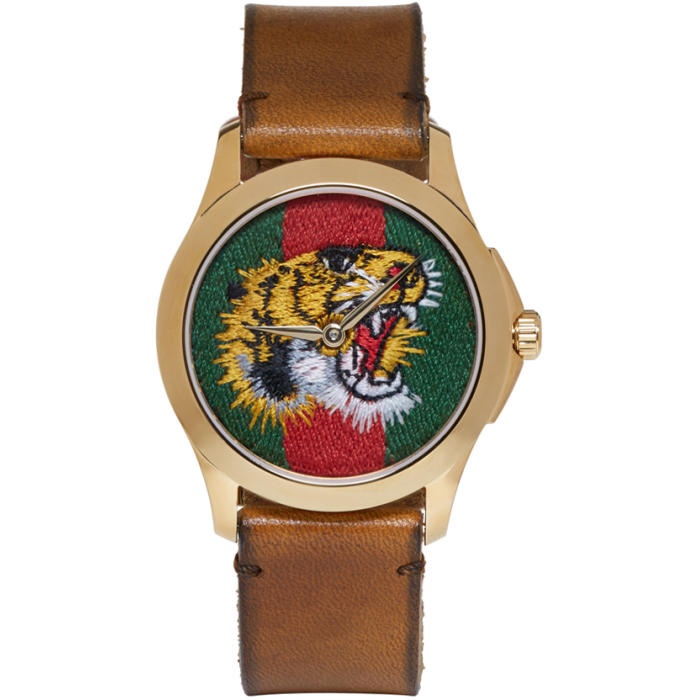 Photo: Gucci Gold and Brown Tiger Watch