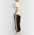 Gucci - Tapered Logo-Jacquard Webbing-Trimmed Tech-Jersey Track Pants - Black