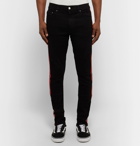 AMIRI - Stack Track Skinny-Fit Striped Distressed Stretch-Denim Jeans - Men - Black