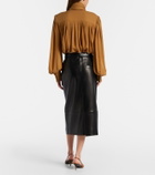 Khaite Anden leather midi skirt