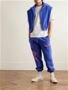 Y,IWO - Lessons Tapered Logo-Print Cotton-Jersey Sweatpants - Blue